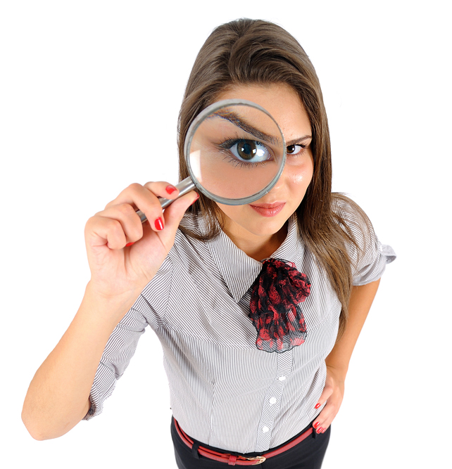 woman using magnifying glass